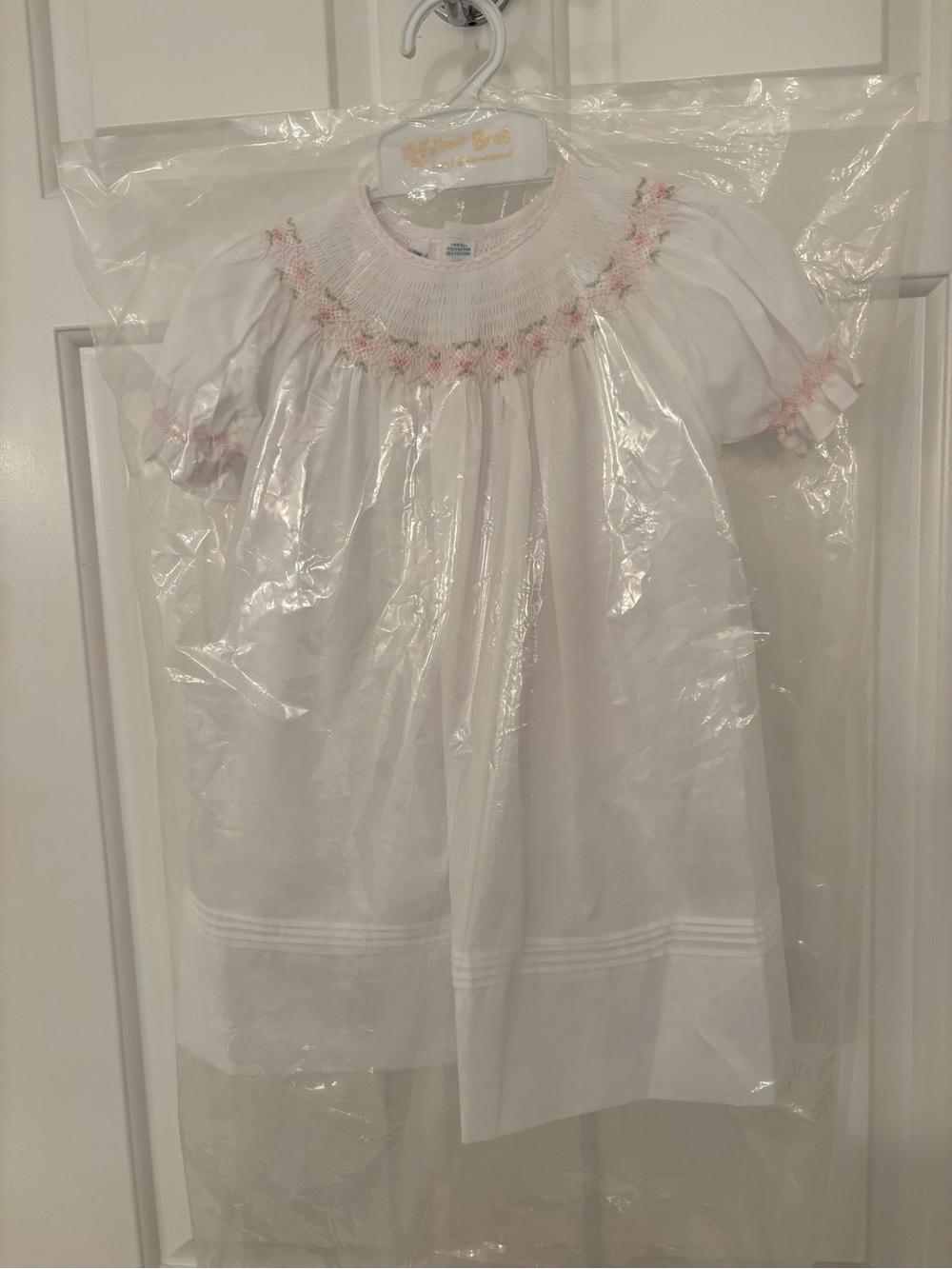 Classic White Smocked Girls' Formal Dress with Pink Detail